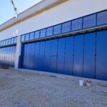 Portoni a libro con guida a pavimento 6+6 con porta U.S.